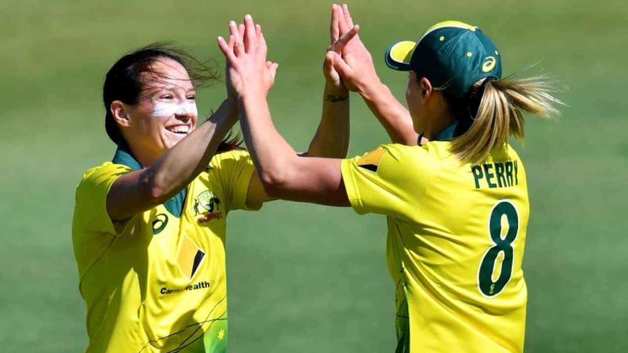 Megan Schutt (left) and Ellyse Perry, Australia.