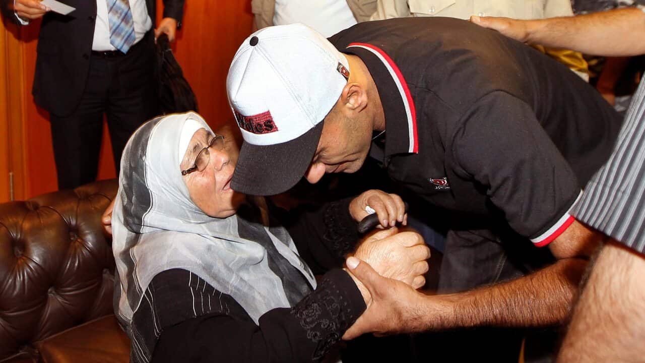 A Lebanese survivor from the boat that sank off Java Island greets his mother on his return to Beirut - AAP-1.jpg