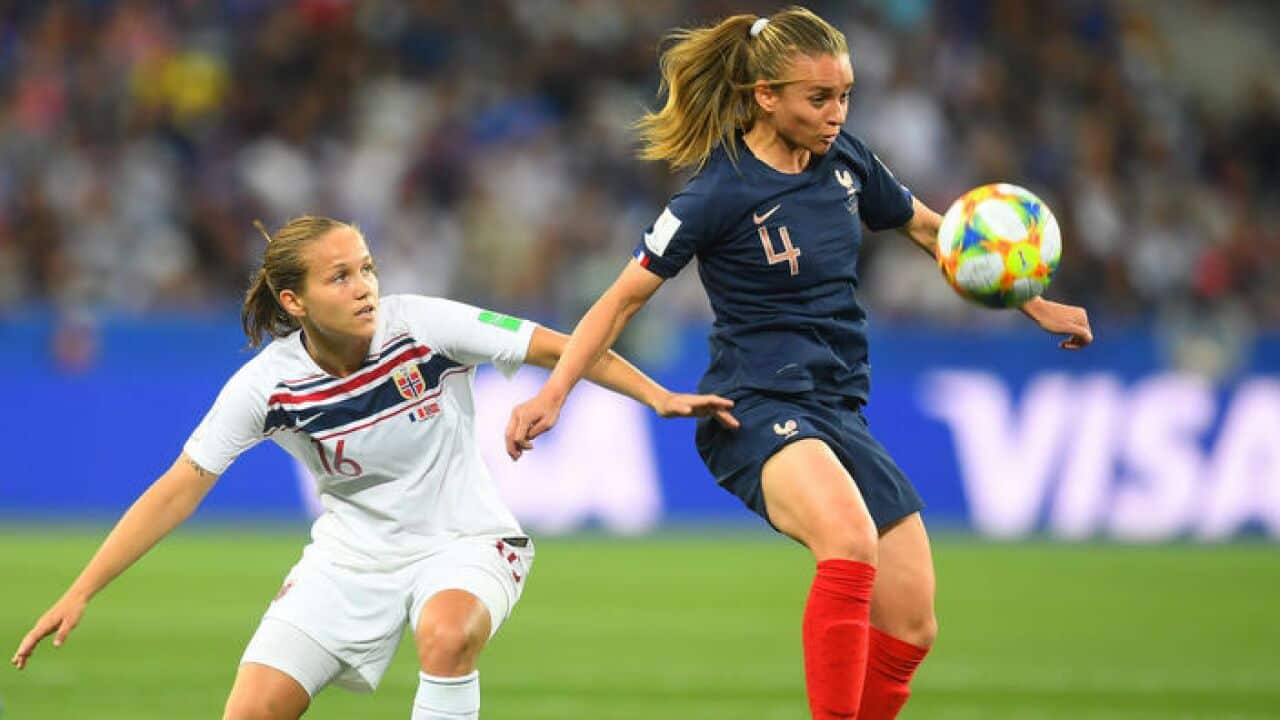 Marion Torrent of France is challenged by Guro Reiten of Norway during the 2019 FIFA Women's World Cup