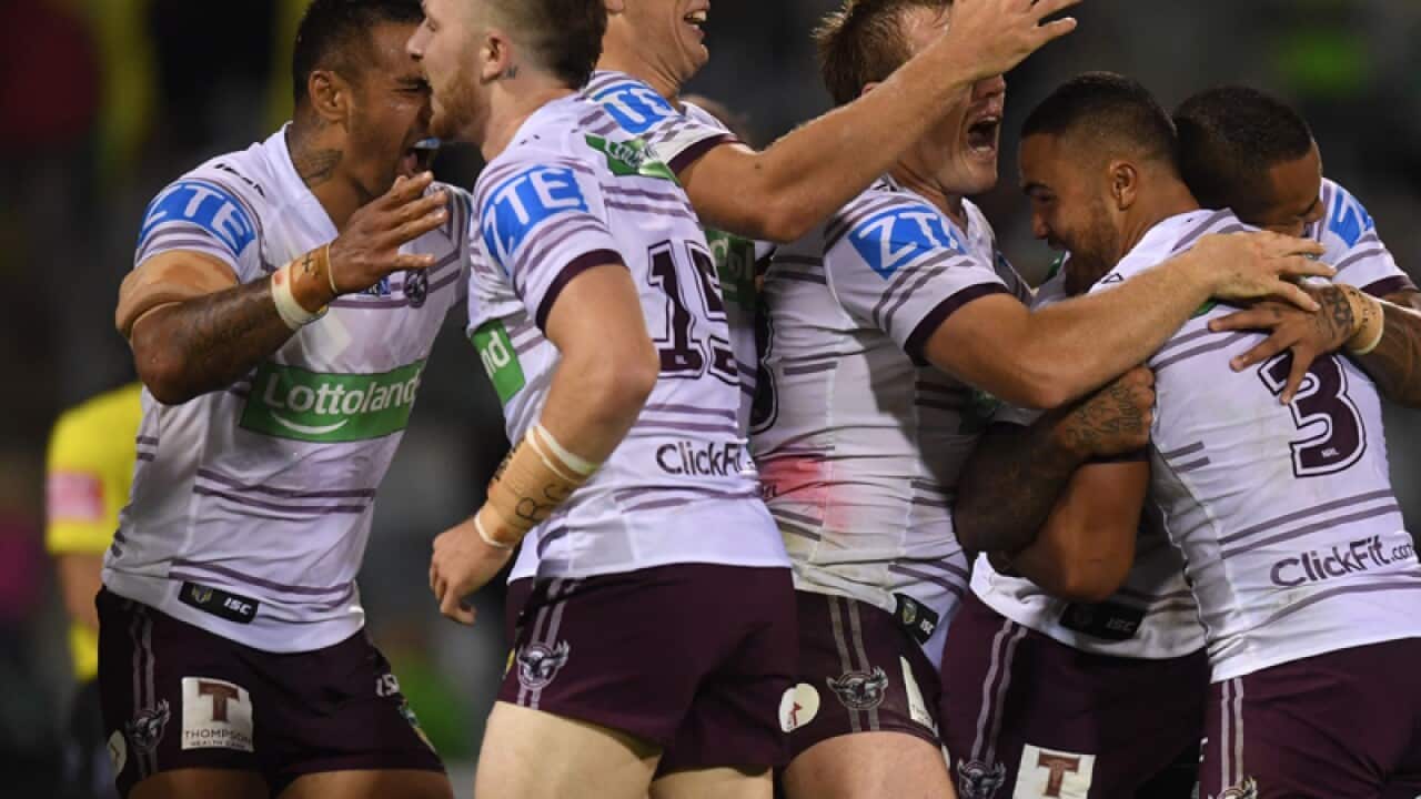 Dylan Walker of the Sea Eagles (centre)