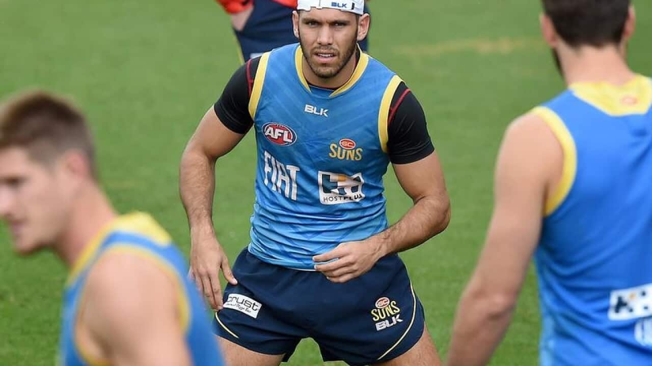 Footballer Harley Bennell trains with his fellow Suns players.