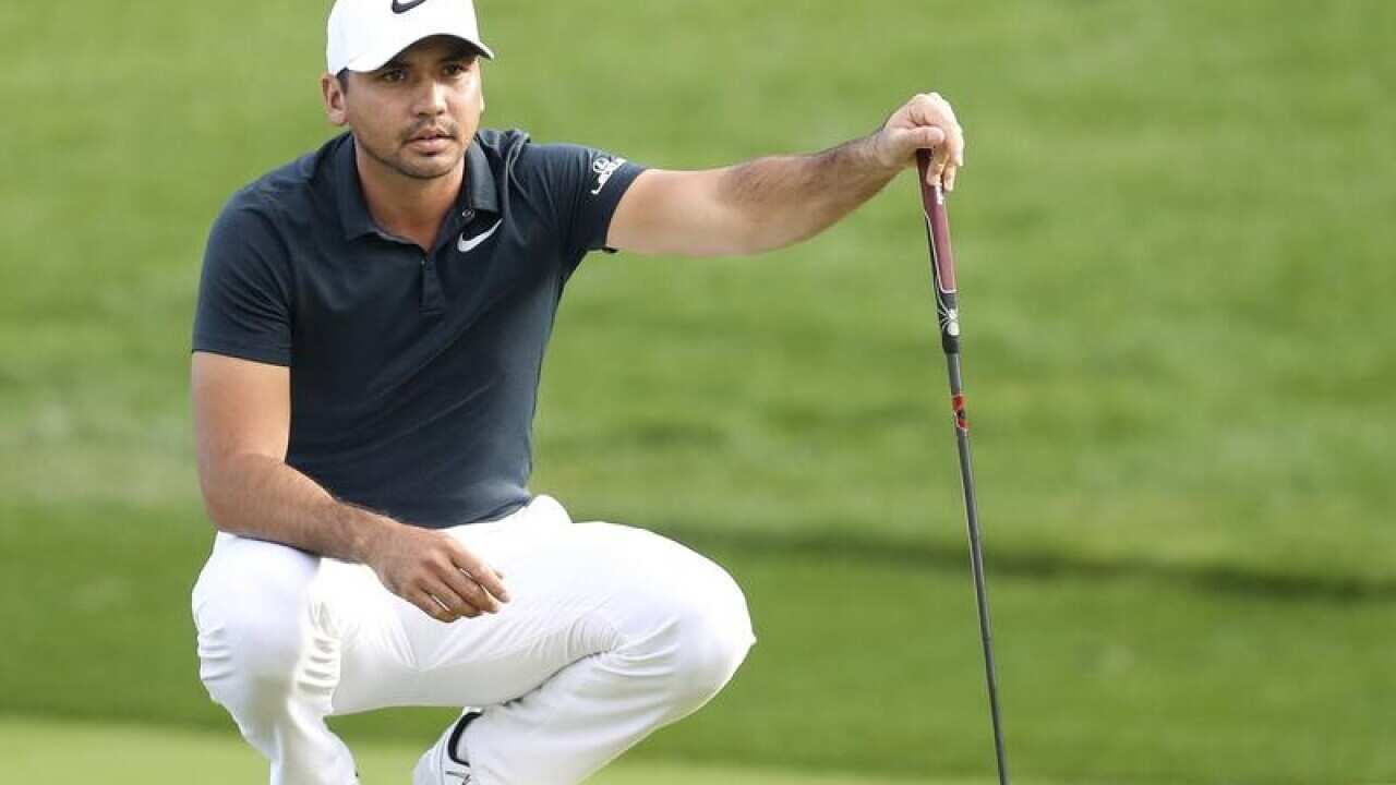Jason Day of Australia lines up his putt.