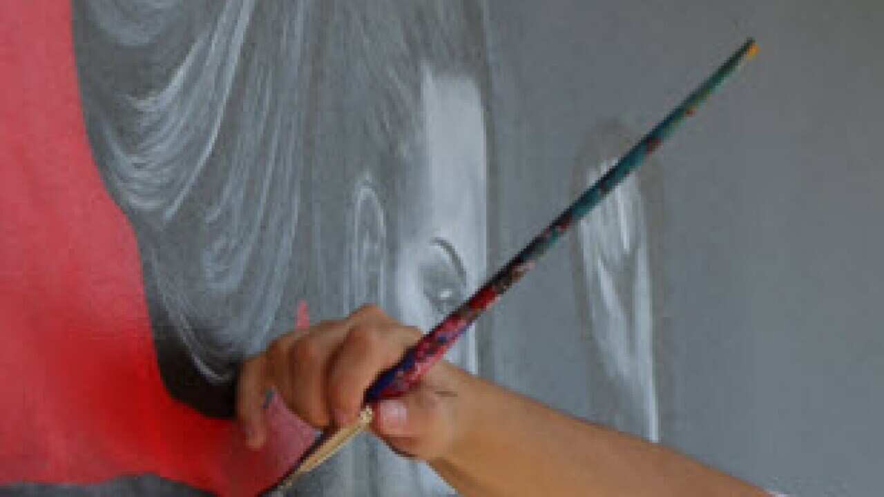 Petrija Pajic painting a mural