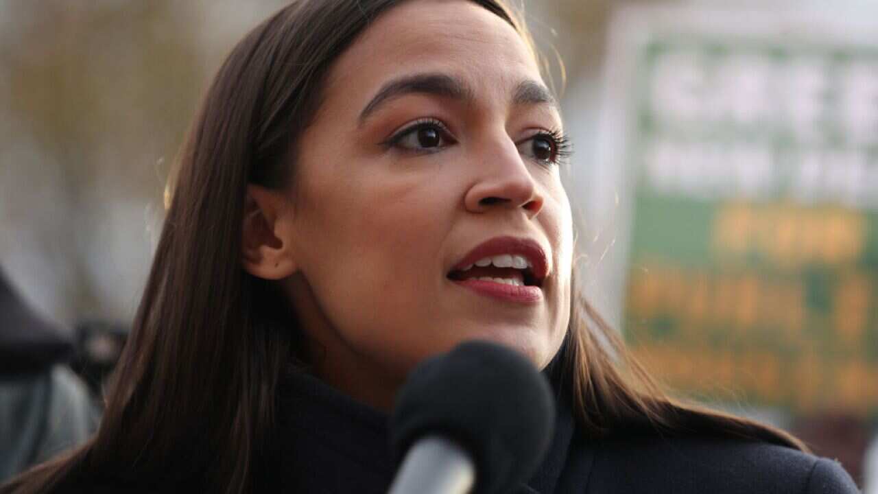 Alexandria Ocasio-Cortez speaks during a news conference outside the US Capitol on 14 November 2019 in Washington, DC.