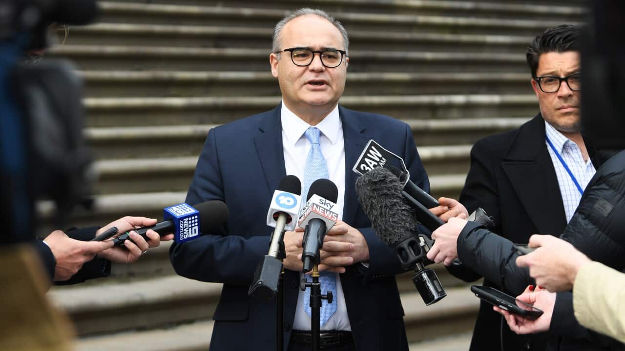 Former local Government Minister Adem Somyurek speaks to reporters outside State Parliament in Melbourne in 2019.