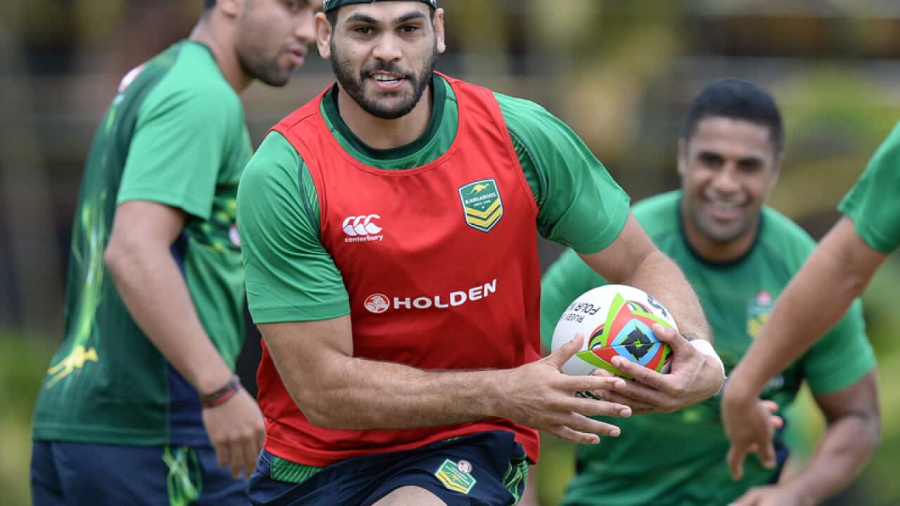 Greg Inglis runs with the ball during Kangaroos training