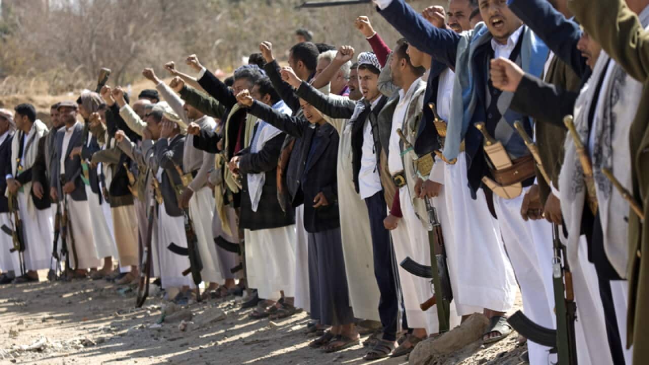 Members of the Shi'ite Houthi militia stand guard.