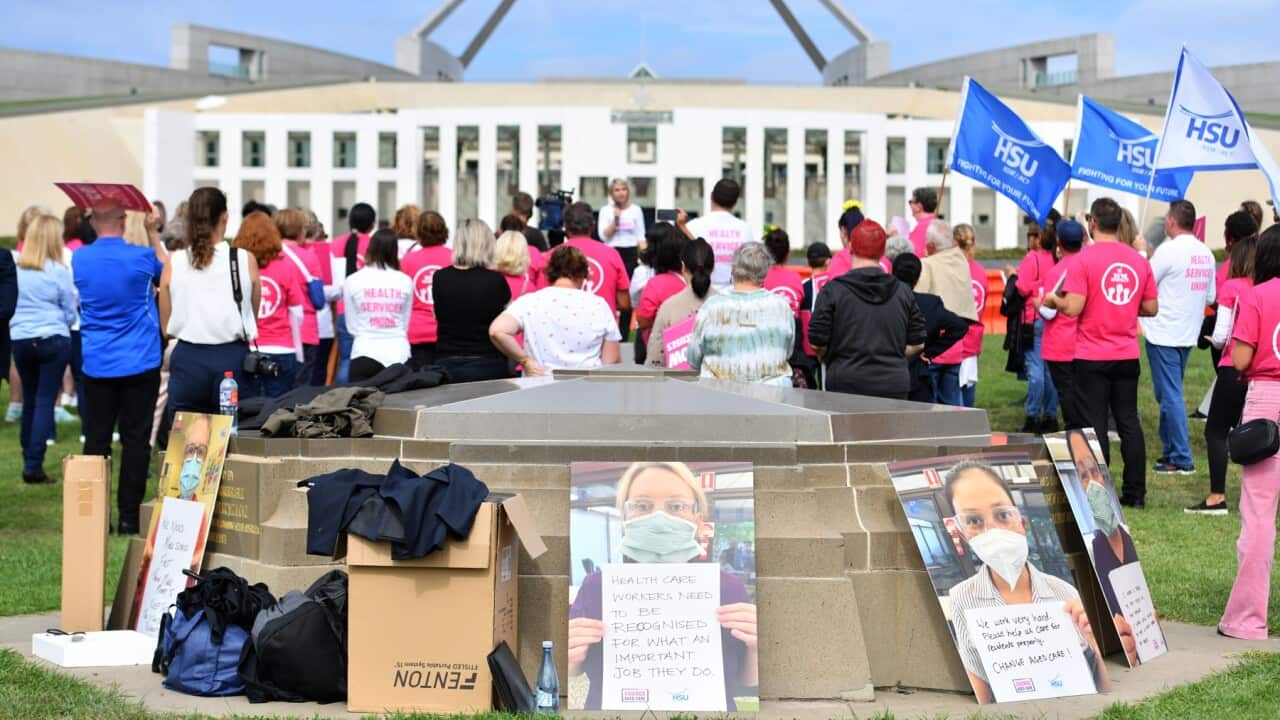 Aged care workers are seen protesting outside Parliament House in Canberra