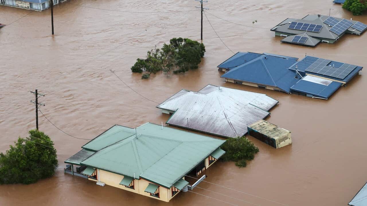 Houses are seen submerged in water.