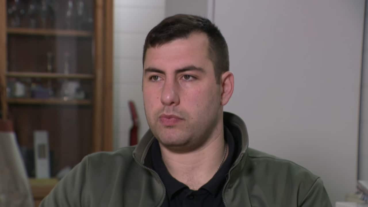 A man sitting for an interview