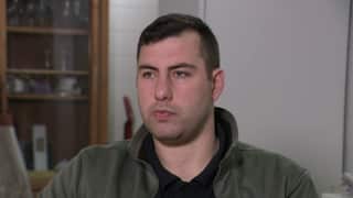 A man sitting for an interview