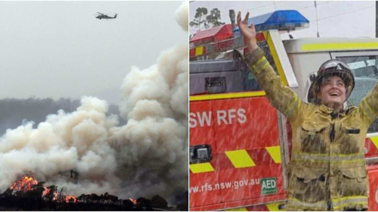A military helicopter flies above a fire in Eden - RFS staff celebrating rainfall