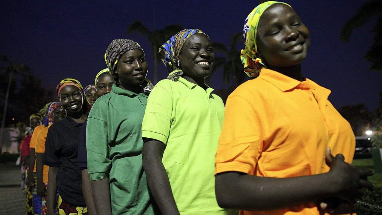 (File Image) Some of the 82 released Chibok girls wait to meet Nigerian President Muhammadu Buhari earlier this month.