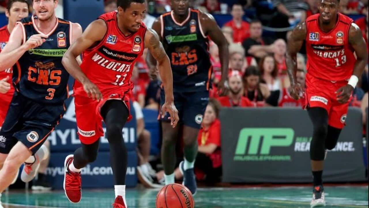 Bryce Cotton of the Wildcats in action