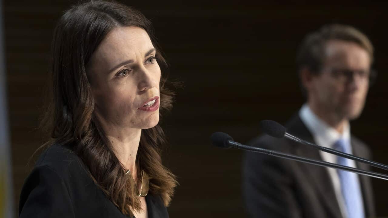 Jacinda Ardern (L) during a press conference with Director General of Health Ashley Bloomfield (R)