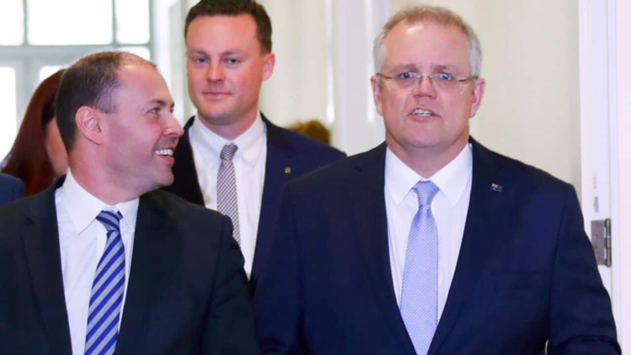 Scott Morrison, right, walks with Josh Frydenberg