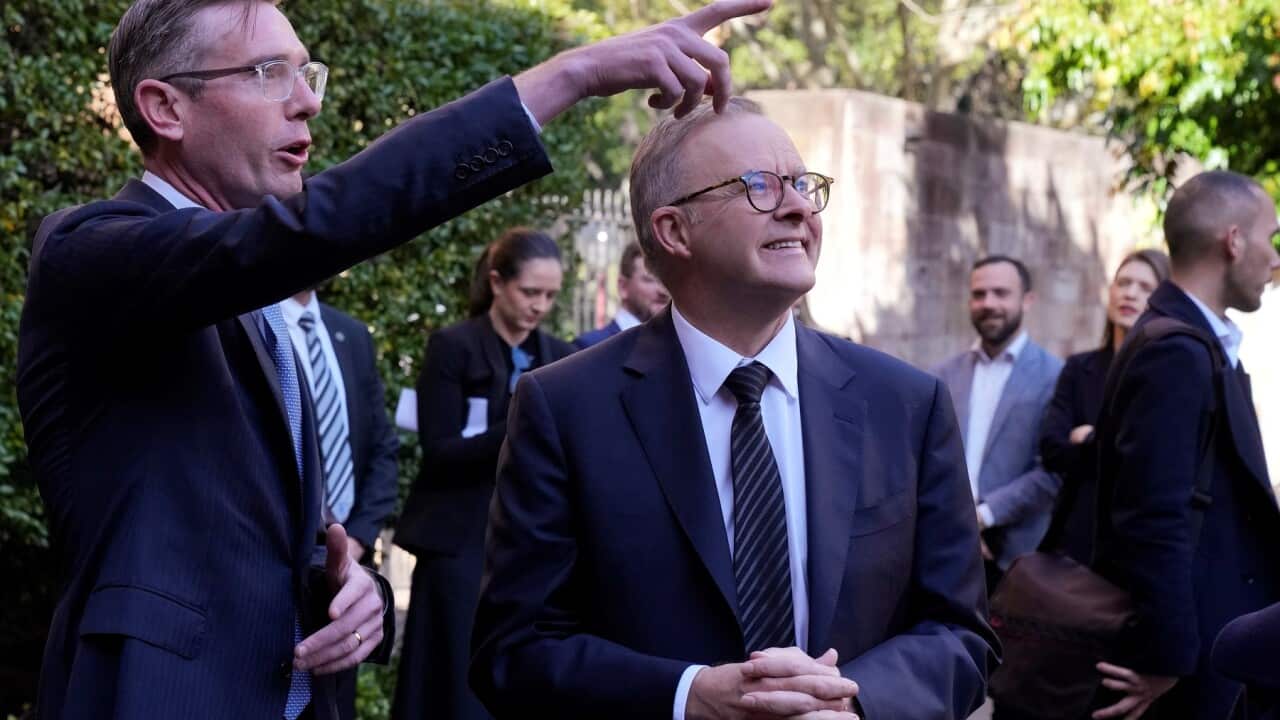 Anthony Albanese, centre, and New South Wales Premier Dominic Perrottet (AAP)