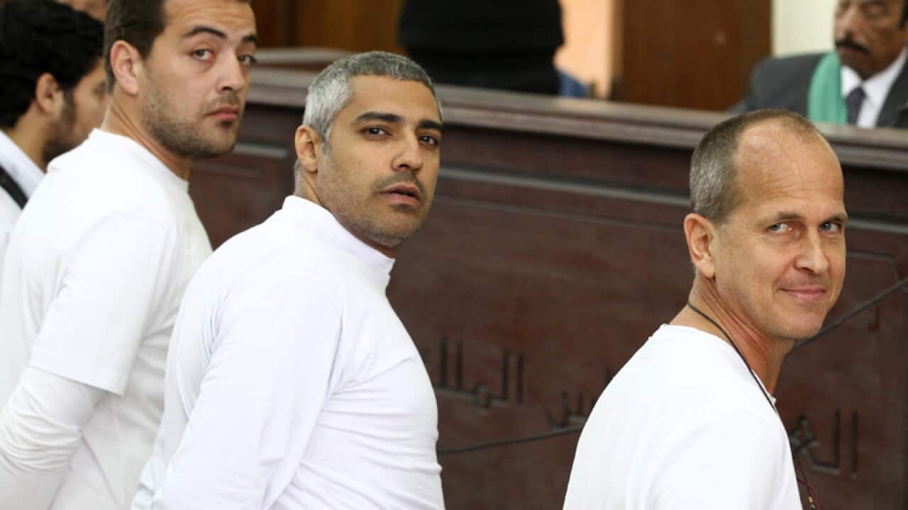 (L-R) Journalists Baher Mahmoud, Mohammed Fahmy and Peter Greste