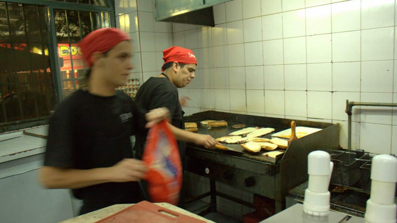 A fast-food cook at work.