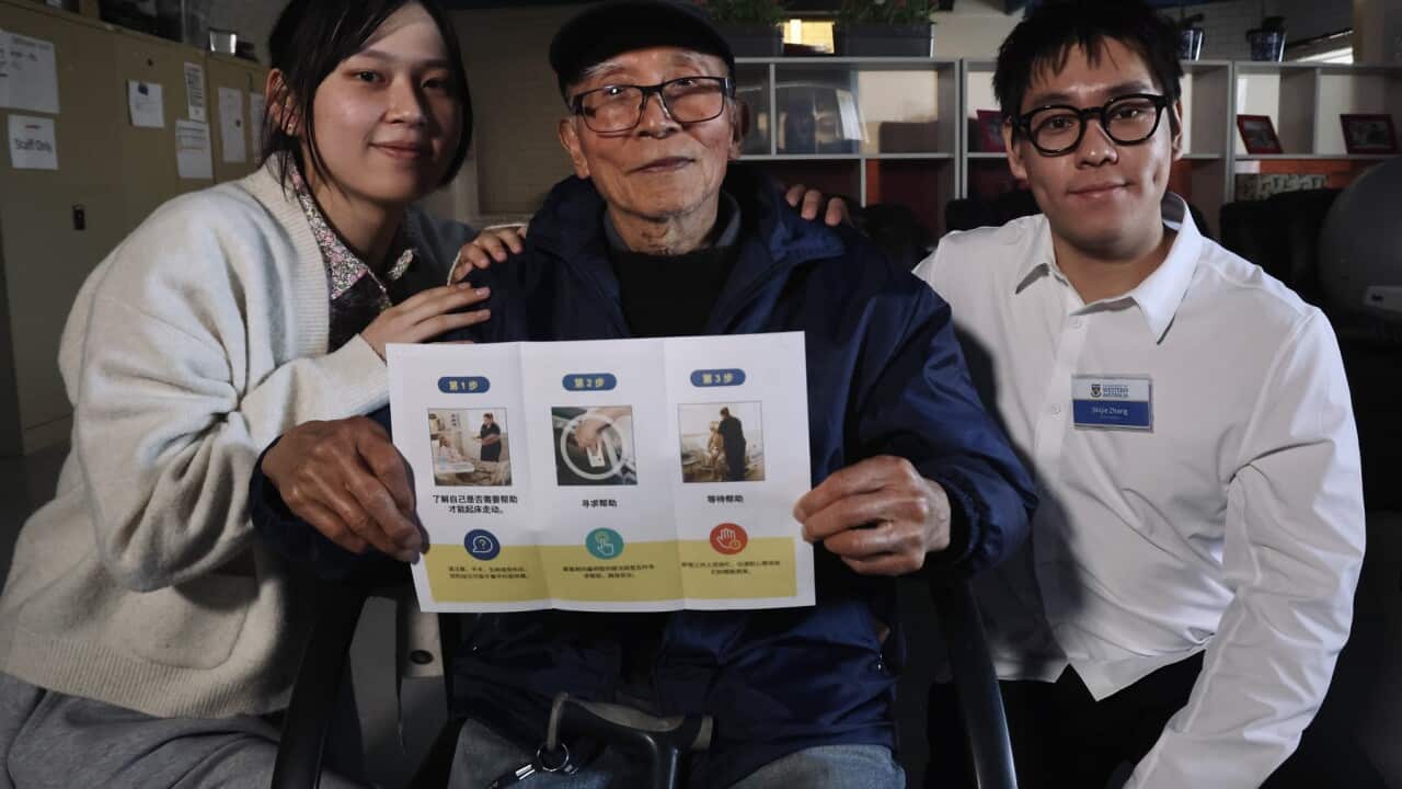University students Zhou Yuening and Zhang Shijie with elder Liu Xuxiang at a falls prevention workshop in Perth (Christopher Tan SBS).jpg