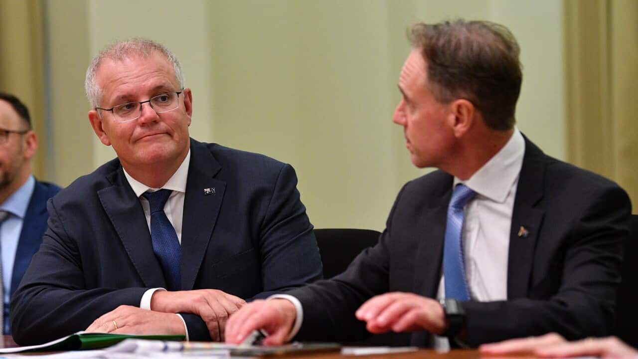 Australian Prime Minister Scott Morrison (left) and the Australian Health Minister Greg Hunt are seen during a GP roundtable conference at the Commonwealth Parliamentary offices in Melbourne, Friday, March 19, 2021. (AAP Image/James Ross) NO ARCHIVING