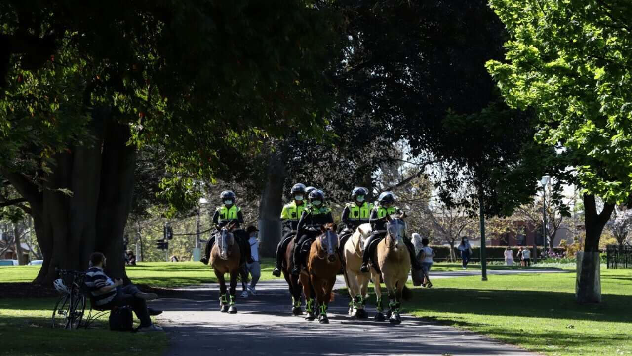 Mounted Police officers patrol Carlton Garden ahead of a planned protest on 23 September, 2021 in Melbourne.