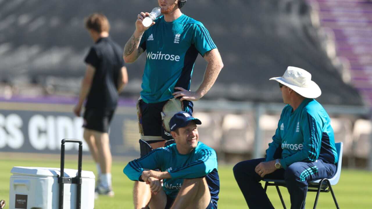 Ben Stokes and coach Trevor Bayliss (R) during a nets session