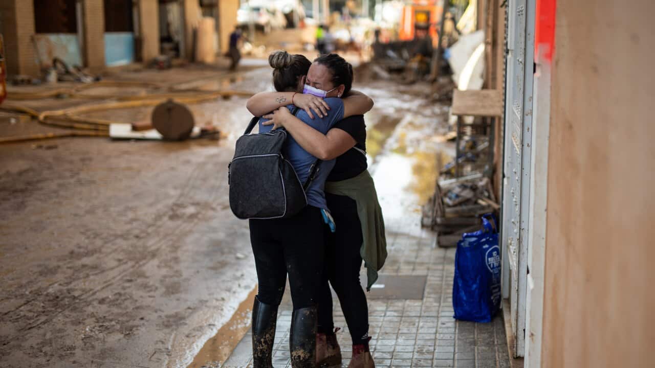 Two women embrace on November 4, 2024, in Benetússer, Valencia, Valencian Community (Spain).