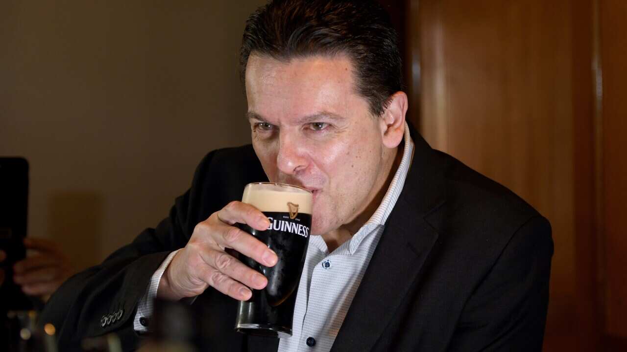 Crossbench senator Nick Xenophon drinks a beer at The British hotel, North Adelaide.