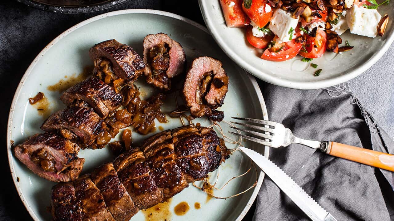 Apricot-stuffed lamb backstrap with tomato and almond salad