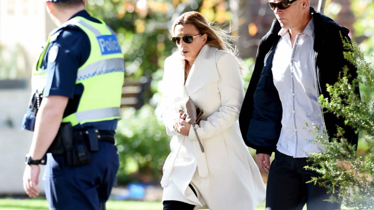 Mourners arrive at the funeral for George Williams