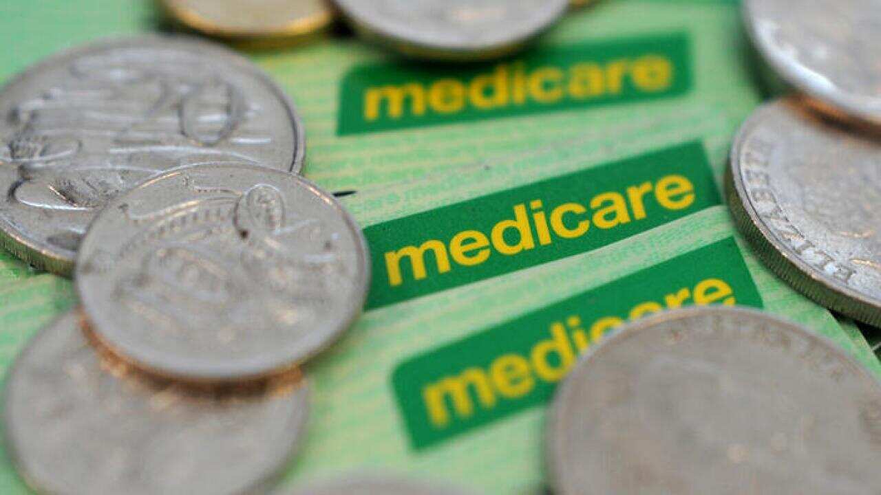 Medicare healthcare cards in Sydney, Wednesday, Jan. 21, 2015. The Federal government has indicated there could be further changes to planned Medicare reforms after dumping a controversial GP rebate. (AAP Image/Joel Carrett) NO ARCHIVING