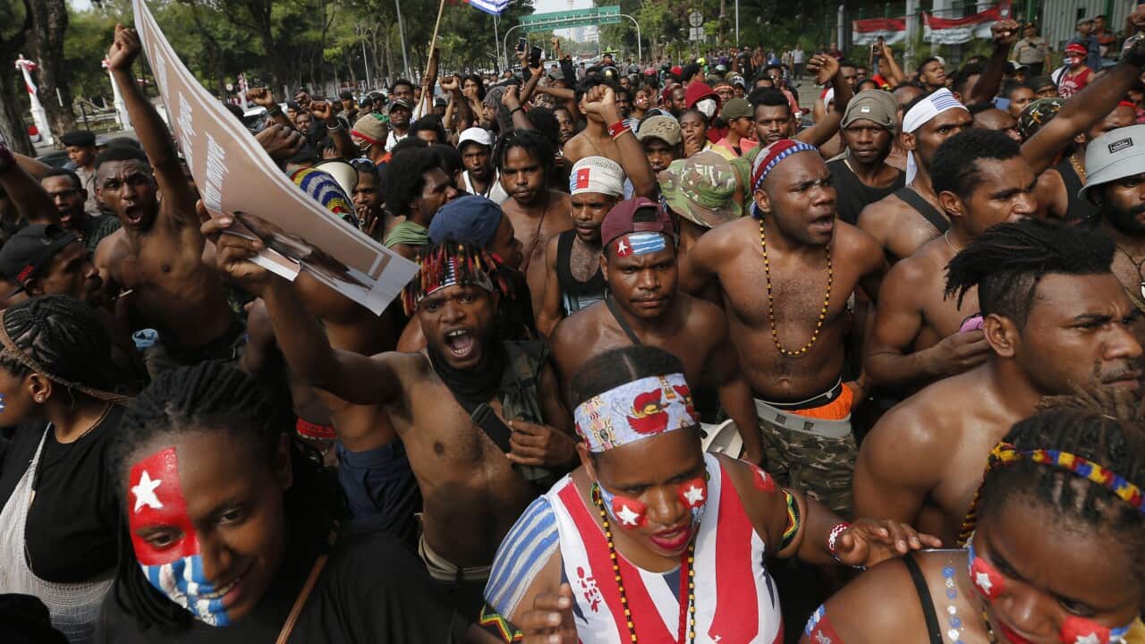 Papuan students shout slogans during a rally near the presidential palace in Jakarta, Indonesia, Wednesday, Aug. 28, 2019.