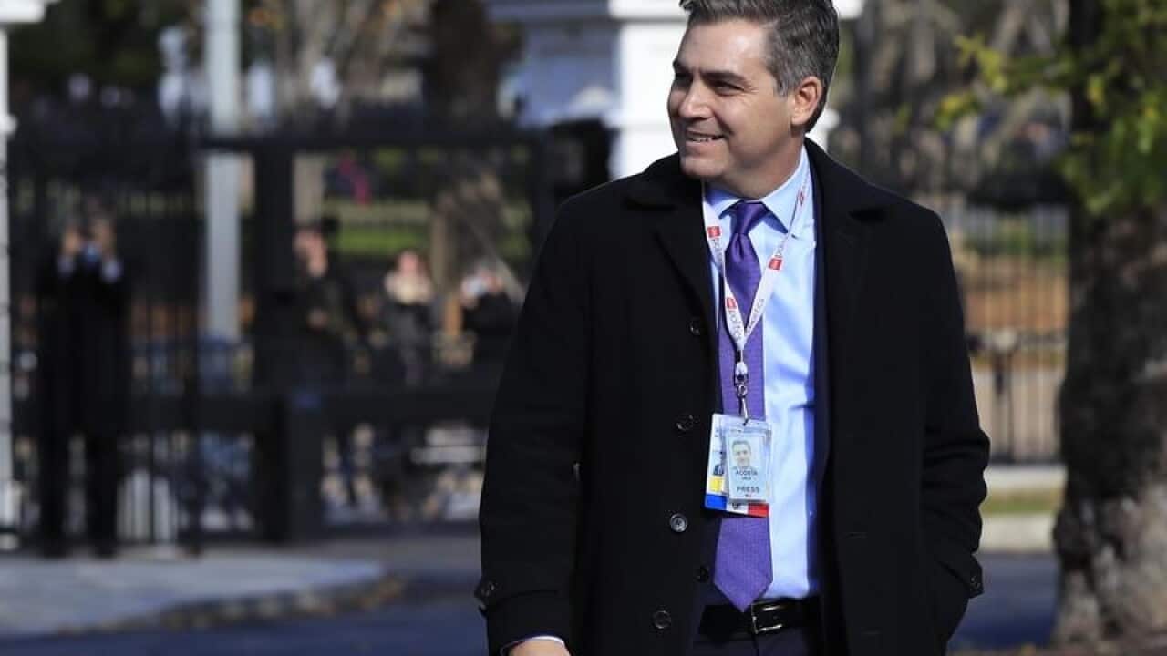 CNN's Jim Acosta wearing his White House "hard pass"