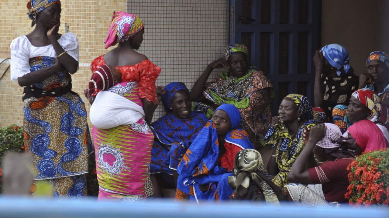 Family members of the Nigerian Chibok kidnapped girls await their departure to meet the Nigerian minister of women affairs in Abuja, Nigeria last week.