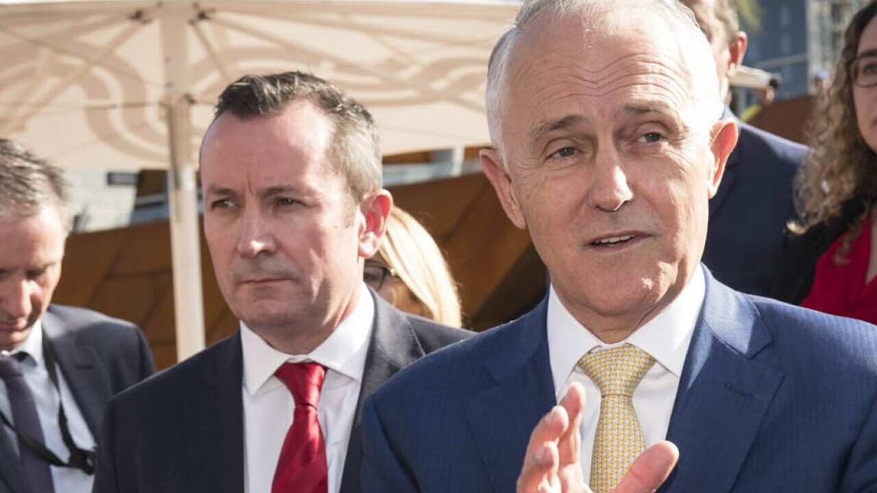 Prime Minister Malcolm Turnbull and Western Australian Premier Mark McGowan (left of Mr Turnbull) during a press conference in Perth, Friday, April 27, 2018. (AAP Image/Tony McDonough) NO ARCHIVING