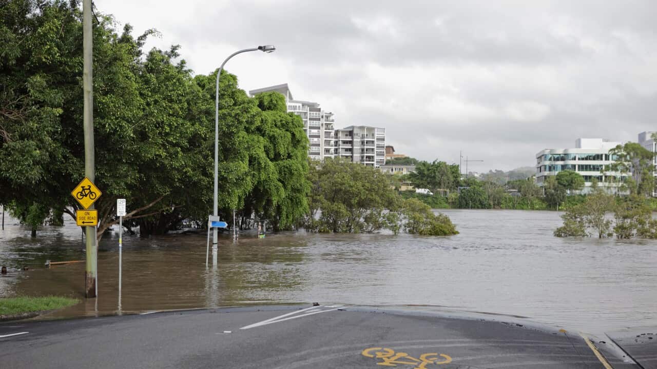 Flooded river over road