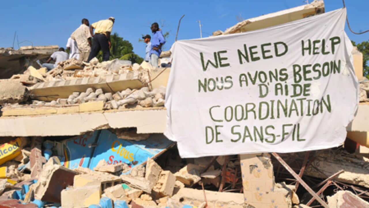 haiti_aid_sign_ruins_100119_B_ap_1716528554