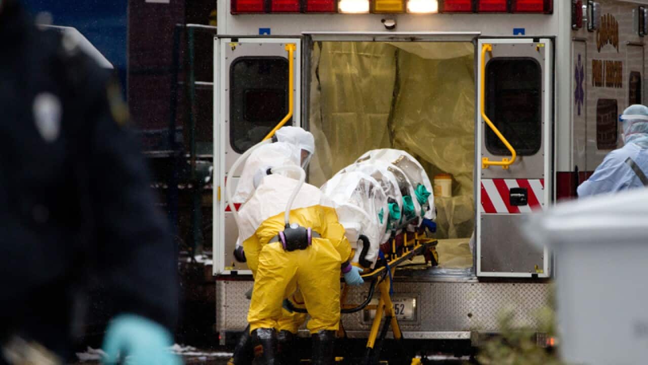 Health workers transport Dr. Martin Salia in Omaha