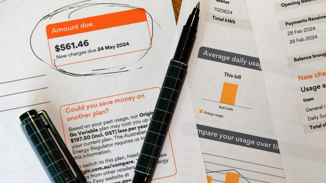 A pen resting on an electricity bill