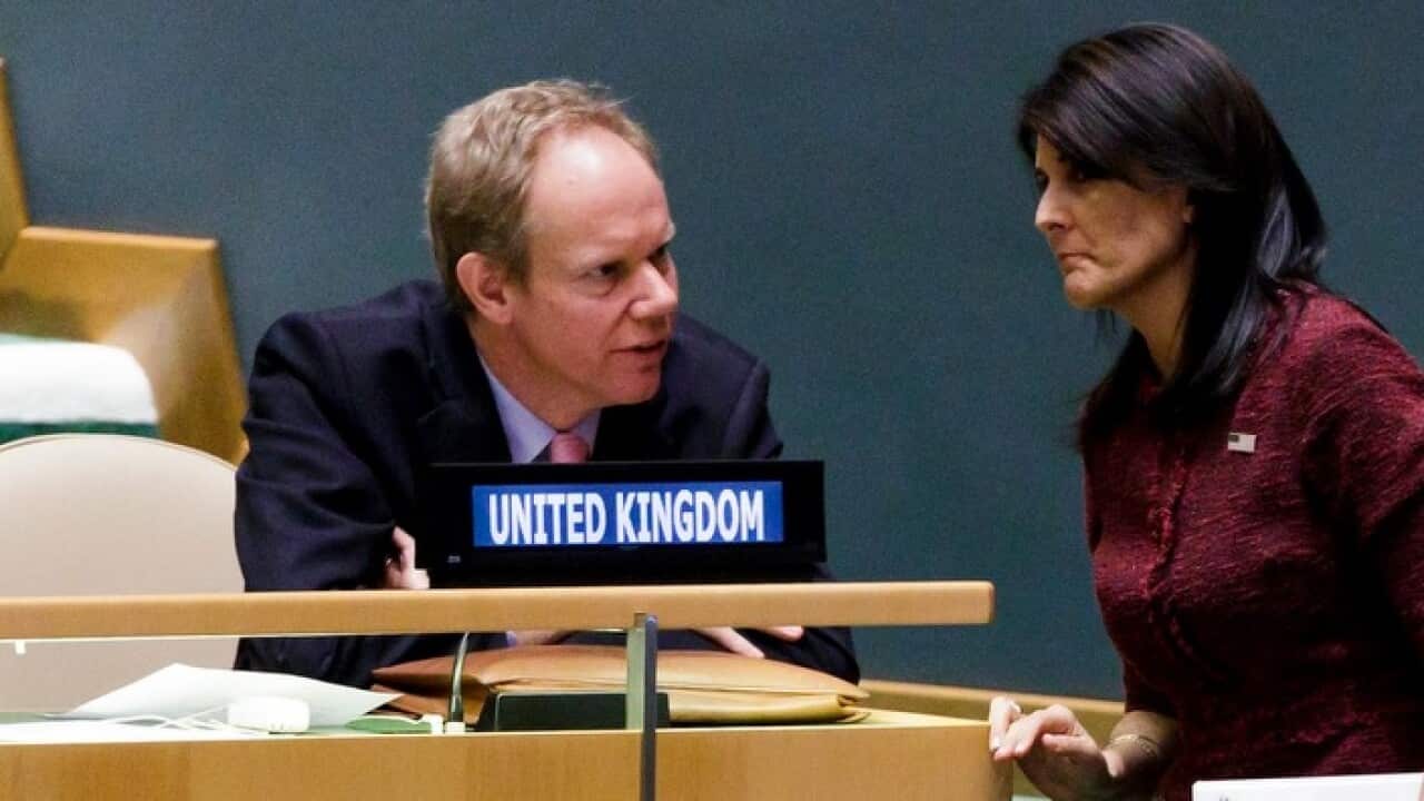 British Ambassador to the United Nations Matthew Rycroft (L) talks with US Ambassador to the United Nations Nikki Haley
