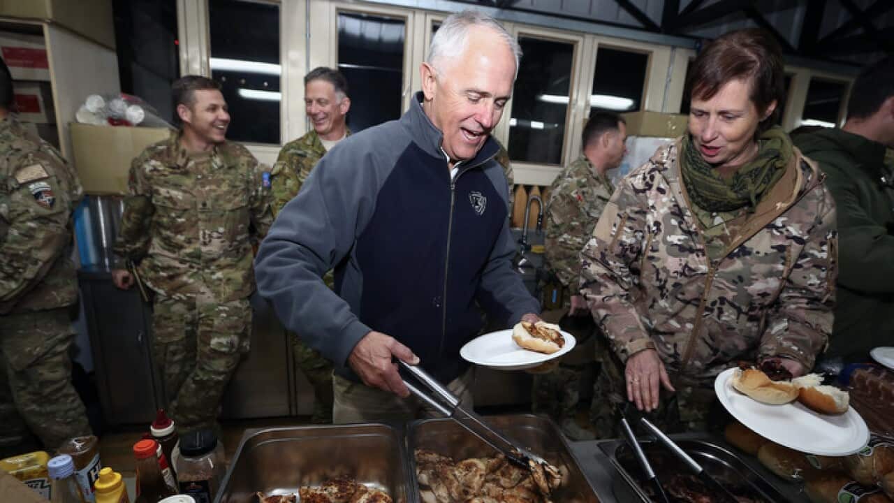 Prime Minister Malcolm Turnbull joins troops for a bbq dinner at the ADF recreation area in Kabul