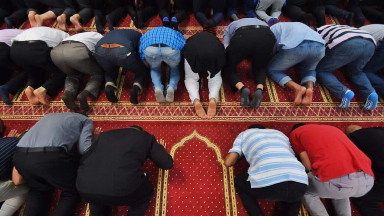 Muslim worshippers pray at a mosque