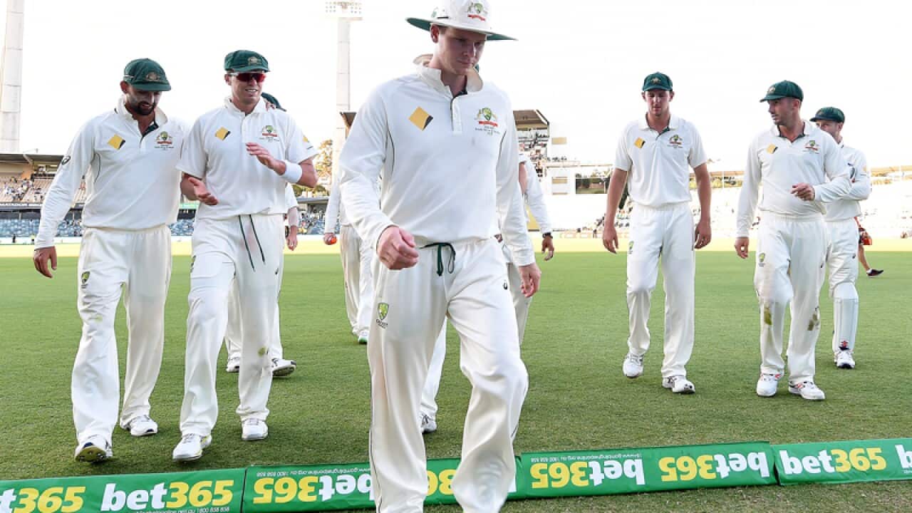 Australian cricketers leave the field at stumps