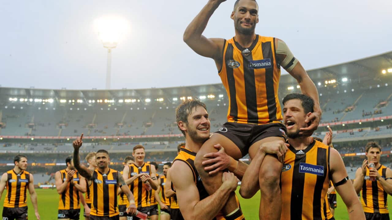 Hawthorn's Josh Gibson is lifted off the field after his 200th game