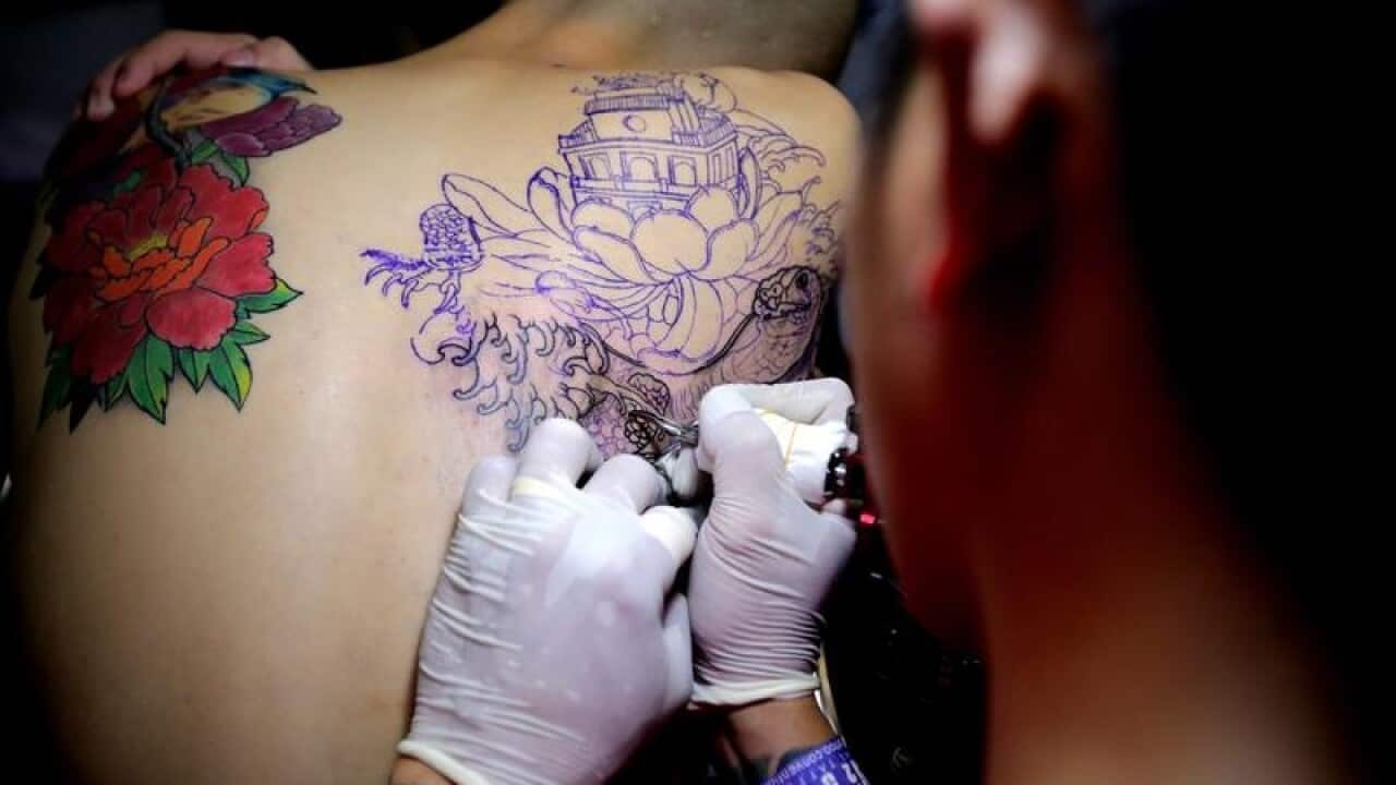 A tattoo artist.