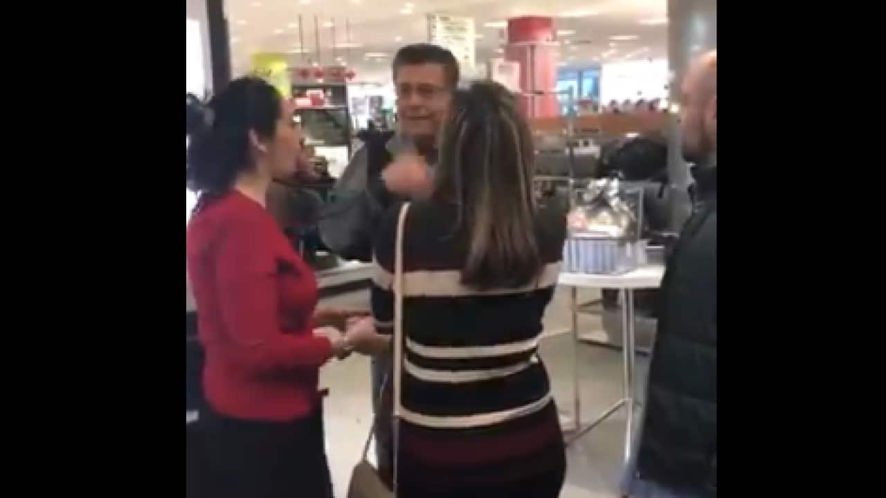 A video posted on Twitter shows a number of customers confronting a man after he allegedly railed at two employees for speaking Arabic.