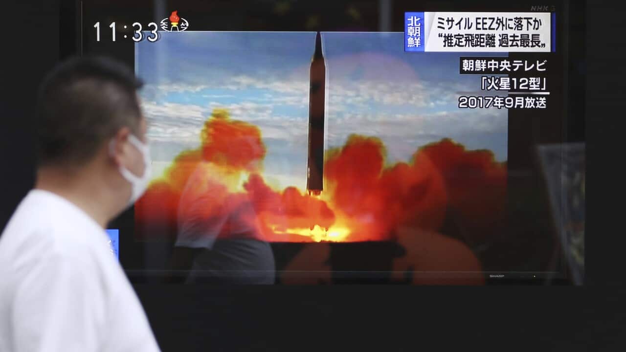 A TV monitor in Tokyo shows North Korea's ballistic missile launch