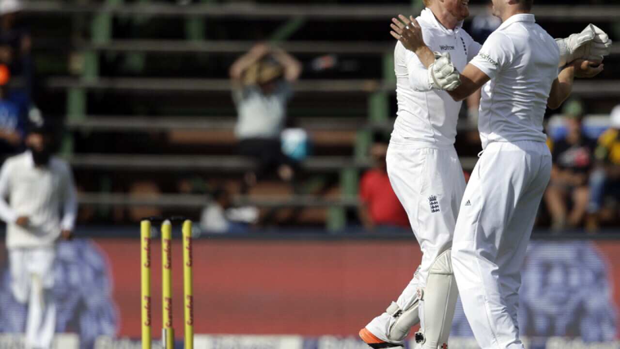 wicketkeeper Jonathan Bairstow (L) celebrates with Chris Woakes