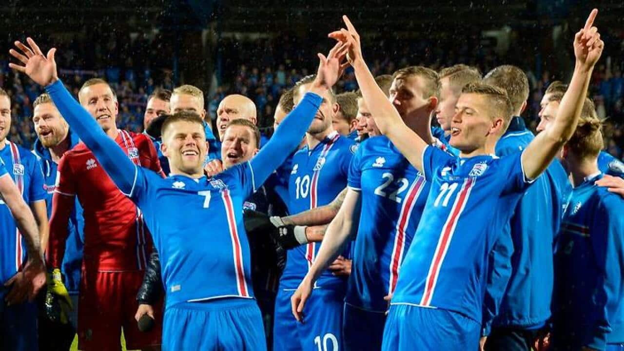 Iceland's players including forward Johann Berg Gudmundsson (L) and Alfred Finnbogason celebrate.